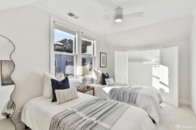 bedroom featuring ceiling fan, carpet flooring, and lofted ceiling