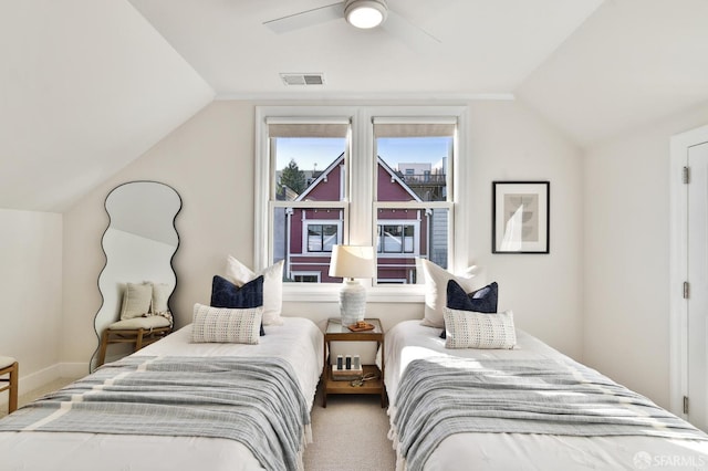 bedroom with carpet flooring, vaulted ceiling, and ceiling fan