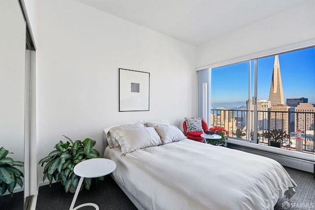 carpeted bedroom featuring multiple windows