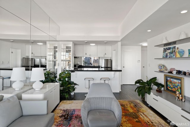 living room featuring dark wood-type flooring