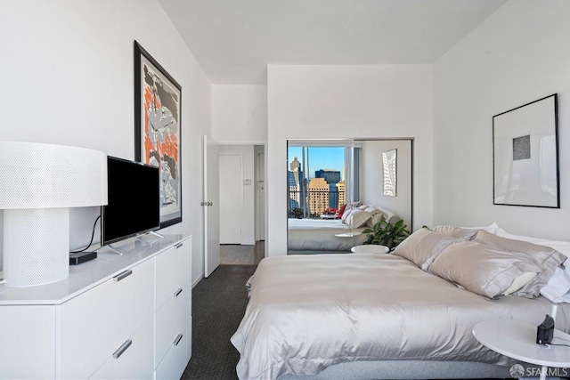 bedroom with dark carpet