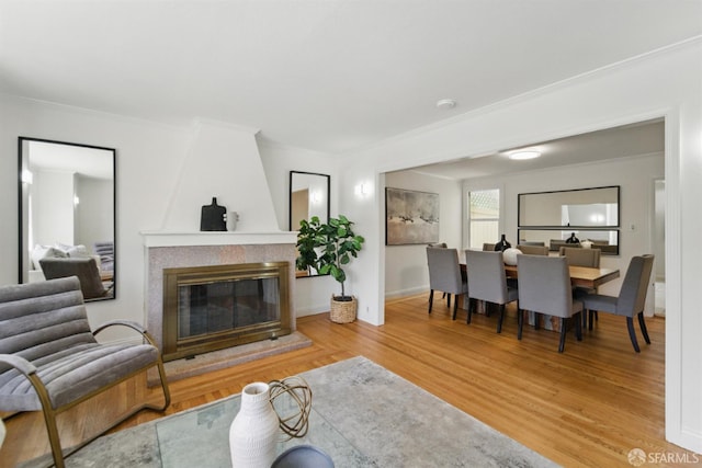 1826 Moraga St, San Francisco, CA 94122 - living room with crown molding, wood finished floors, a large fireplace, and baseboards