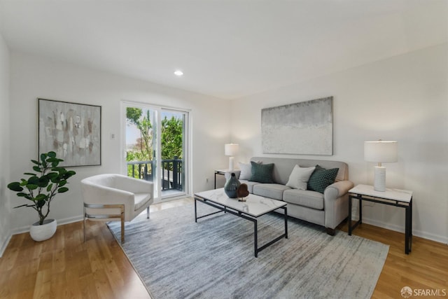 1826 Moraga St, San Francisco, CA 94122 - living room featuring baseboards, wood finished floors, and recessed lighting