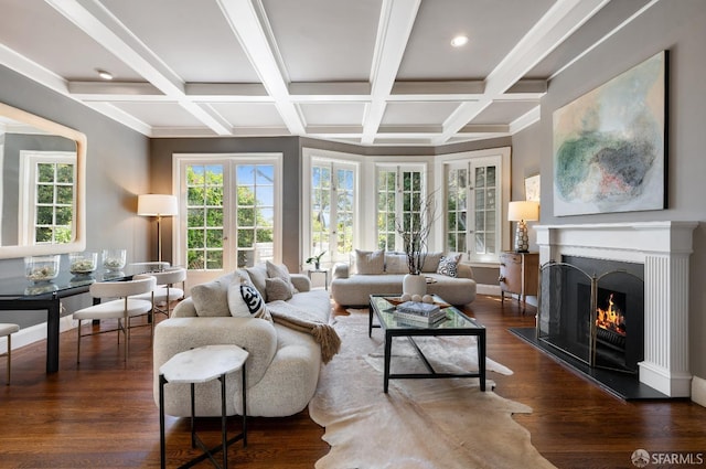 living room with beamed ceiling, a healthy amount of sunlight, and coffered ceiling