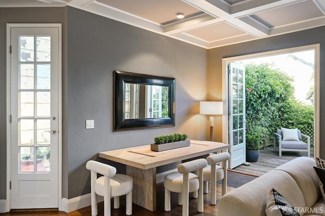 dining space featuring baseboards, wood finished floors, beam ceiling, and coffered ceiling