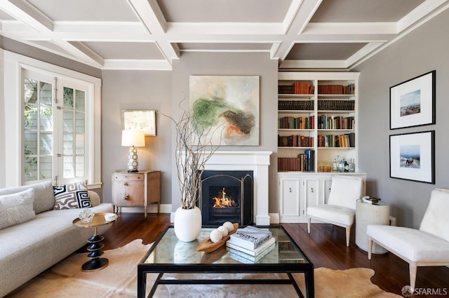 living area with french doors, dark hardwood / wood-style flooring, and built in shelves