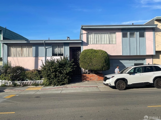 view of front of property featuring a garage