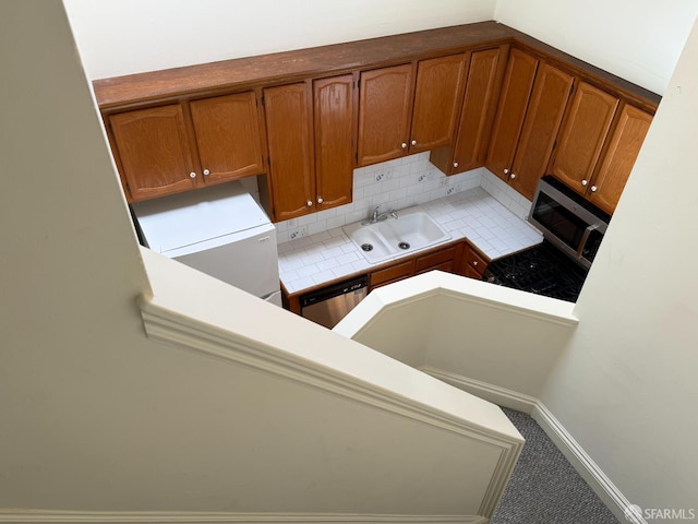 3543-3545 24th St, San Francisco, CA 94110 - kitchen with a sink, brown cabinets, appliances with stainless steel finishes, light countertops, and decorative backsplash