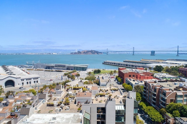 drone / aerial view featuring a view of city and a water view