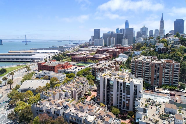 birds eye view of property featuring a view of city and a water view