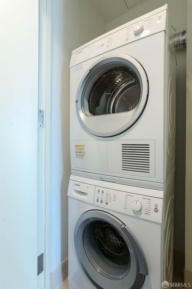 laundry room with laundry area and stacked washer / drying machine