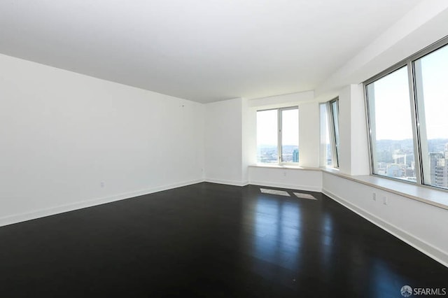 empty room with baseboards