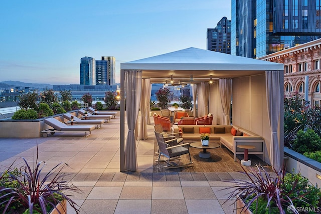 view of patio / terrace featuring a gazebo and a city view