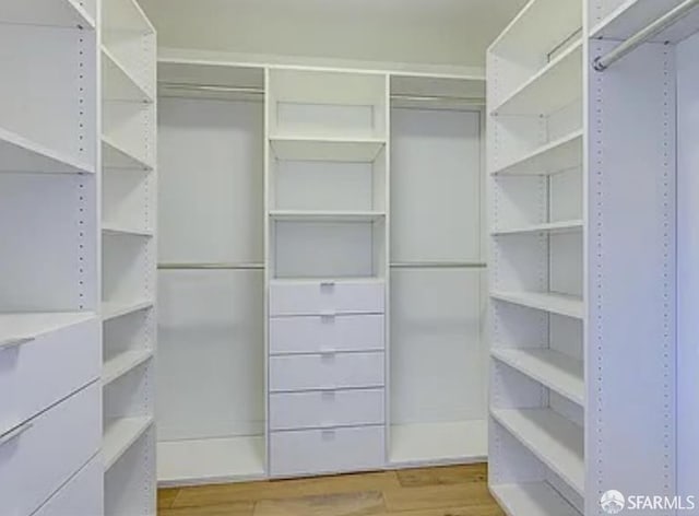 333 Beale St Unit 6J, San Francisco, CA 94105 - spacious closet featuring wood finished floors
