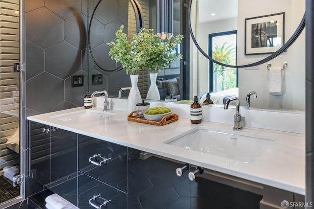 bathroom featuring a sink and double vanity