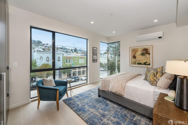 bedroom with access to outside, a wall mounted air conditioner, recessed lighting, and multiple windows