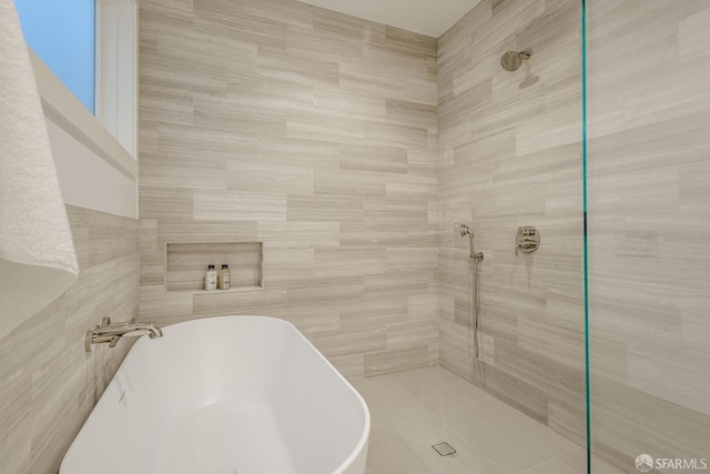 3537 23rd St Unit A, San Francisco, CA 94110 - full bathroom featuring a soaking tub, tiled shower, and tile walls