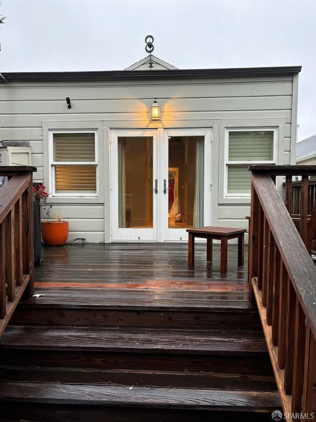 wooden deck featuring french doors