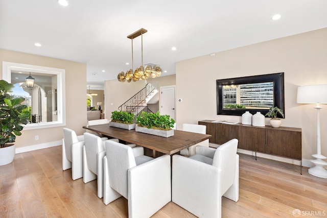 dining area with light hardwood / wood-style floors