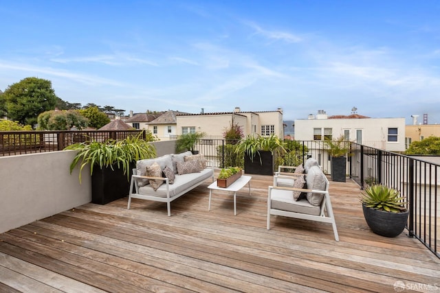 wooden terrace featuring outdoor lounge area