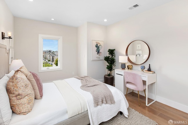 bedroom with light hardwood / wood-style floors