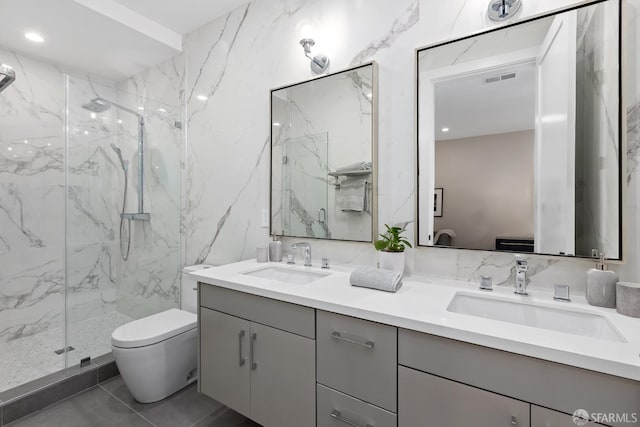 bathroom with tile patterned flooring, vanity, toilet, and a shower with door