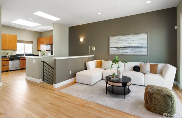 3310 19th St Unit 303, San Francisco, CA 94110 - living area featuring light wood-type flooring, recessed lighting, and baseboards