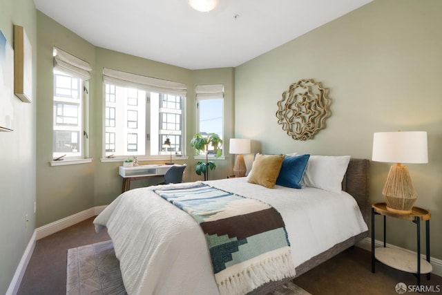 3310 19th St Unit 303, San Francisco, CA 94110 - carpeted bedroom with multiple windows and baseboards