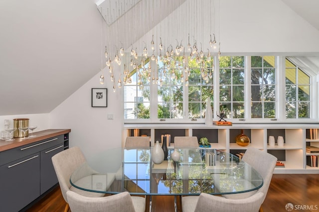 dining area with dark hardwood / wood-style flooring and vaulted ceiling