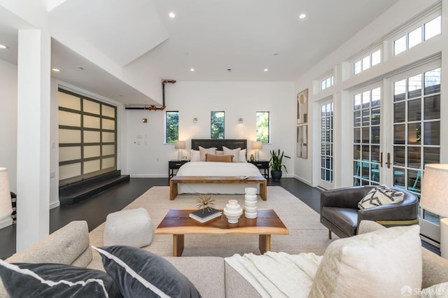 bedroom with dark hardwood / wood-style flooring, access to outside, and french doors