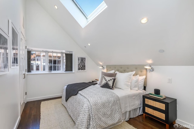 bedroom with dark hardwood / wood-style floors and vaulted ceiling with skylight