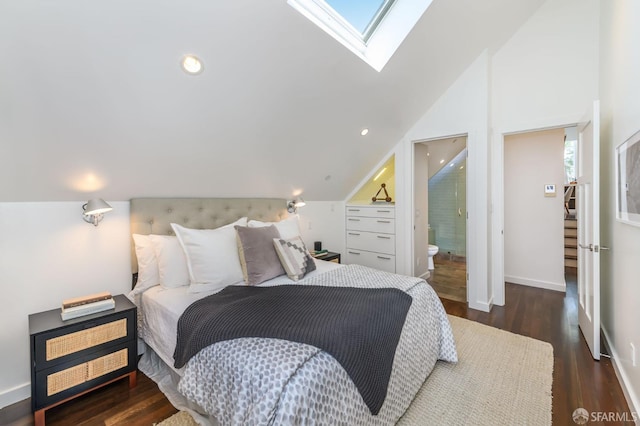 bedroom with ensuite bathroom, vaulted ceiling with skylight, and dark hardwood / wood-style flooring