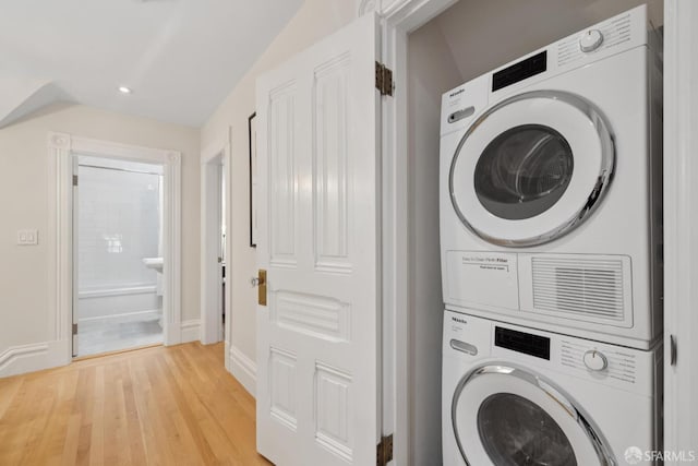 2531 Gough St, San Francisco, CA 94123 - laundry room featuring stacked washing machine and dryer, light wood finished floors, and recessed lighting