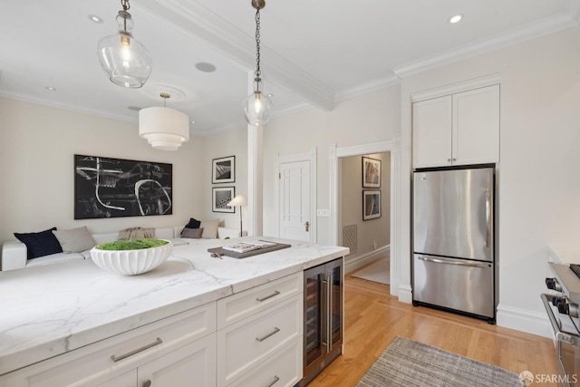 2531 Gough St, San Francisco, CA 94123 - kitchen featuring freestanding refrigerator, beverage cooler, stove, white cabinetry, and open floor plan
