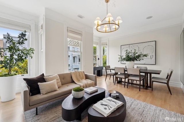 2531 Gough St, San Francisco, CA 94123 - living room featuring plenty of natural light, a chandelier, and light wood-style floors