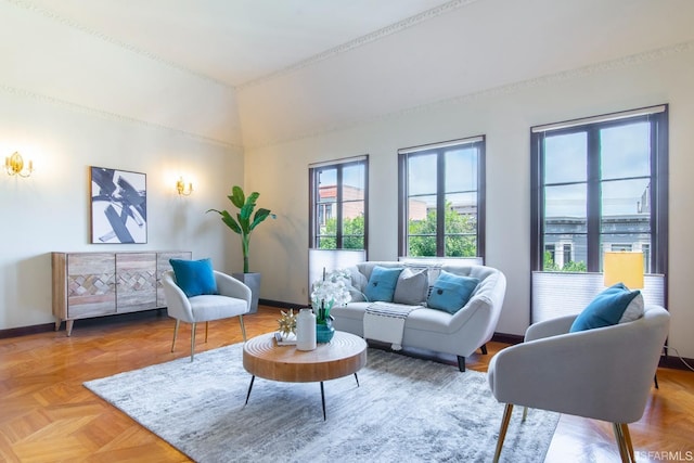 sitting room featuring vaulted ceiling and baseboards