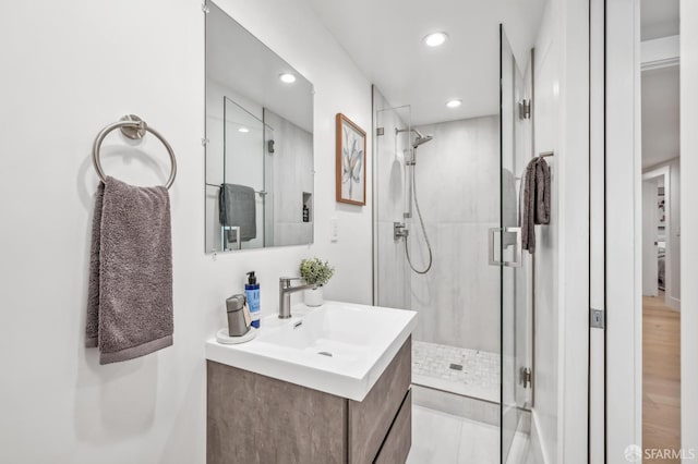 full bathroom with vanity, recessed lighting, and a stall shower