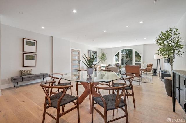 dining area featuring light wood finished floors and recessed lighting