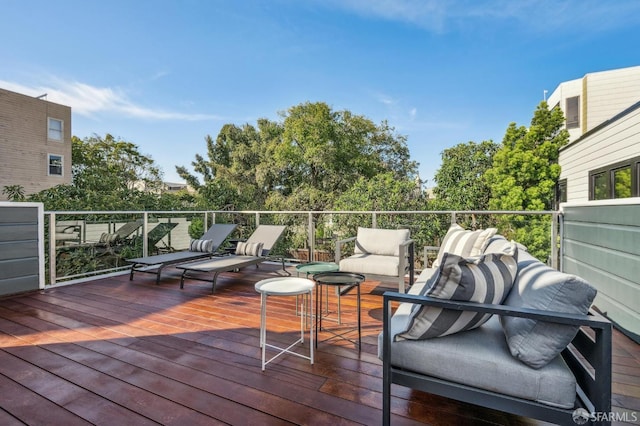 wooden terrace featuring outdoor lounge area