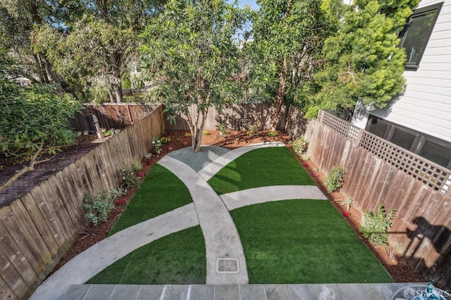 view of yard featuring a fenced backyard