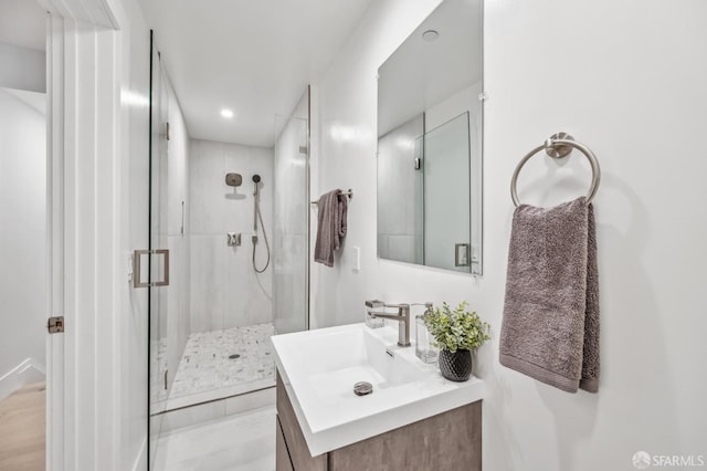 full bath featuring recessed lighting, a stall shower, and vanity