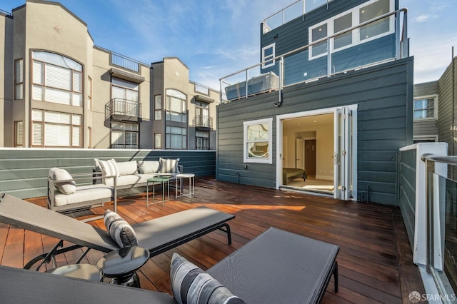 wooden terrace featuring an outdoor hangout area