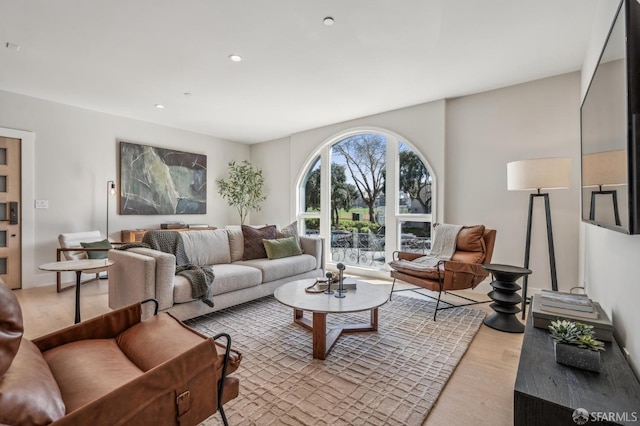 living area featuring recessed lighting and light wood-style floors