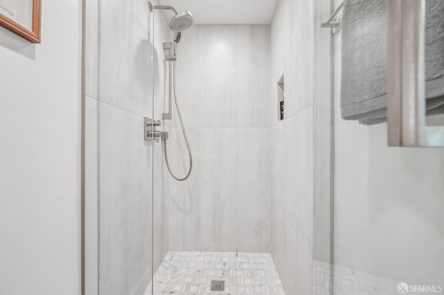 full bathroom featuring a shower stall