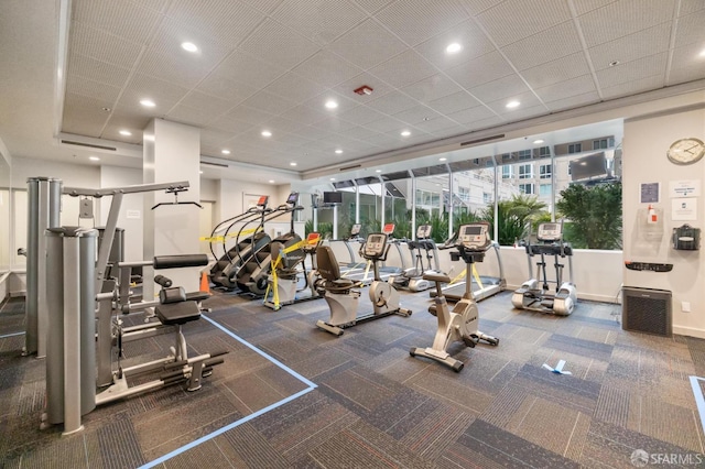 workout area featuring recessed lighting and carpet
