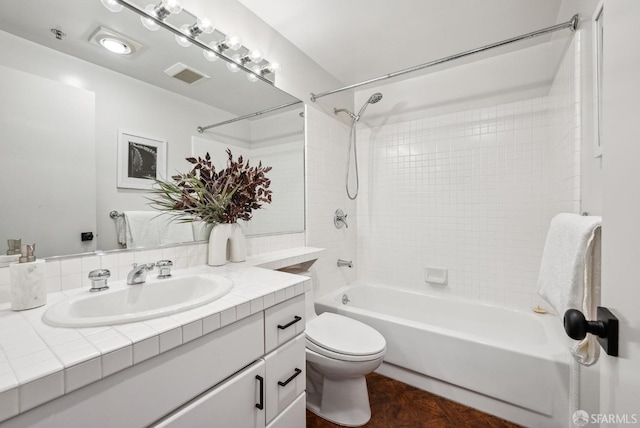 bathroom with vanity,  shower combination, visible vents, and toilet
