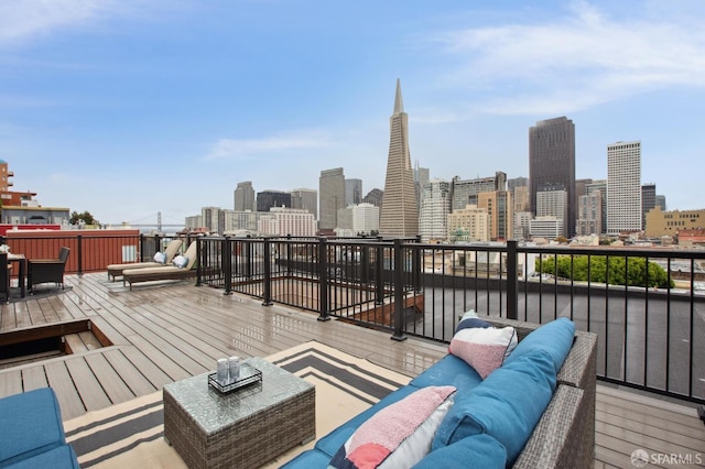 deck with a city view and an outdoor hangout area