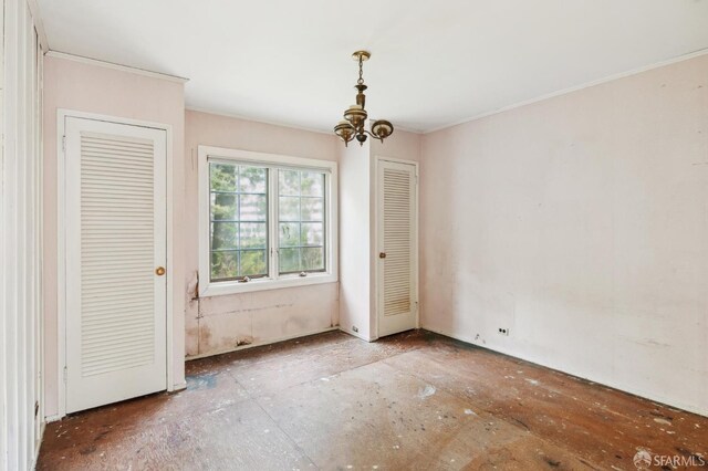 199 Edgewood Ave, San Francisco, CA 94117 - unfurnished bedroom featuring crown molding and a notable chandelier