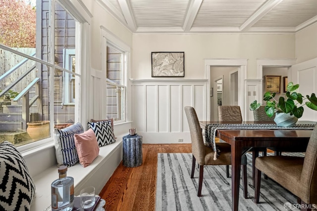 sunroom featuring beam ceiling