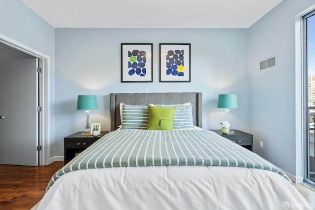 bedroom featuring dark wood-type flooring